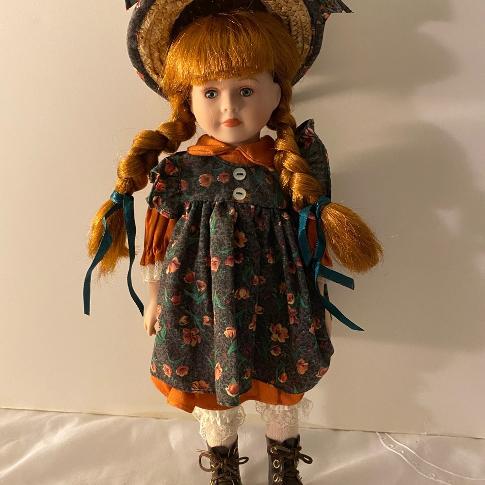 Delton porcelain doll with hat.